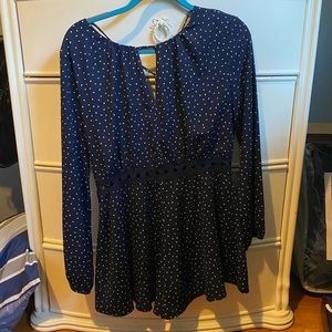 Navy blue and white dotted romper - never worn size L